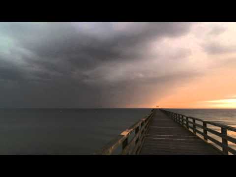 Sunrise and thunderstorm at the beach (time lapse)